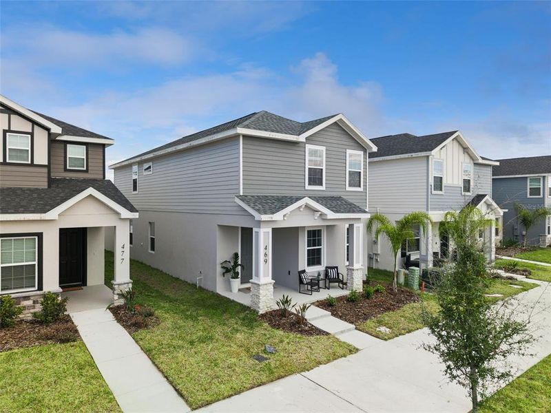 Front exterior of a new home in , St. Cloud, FL, highlighting curb appeal (Image 28).