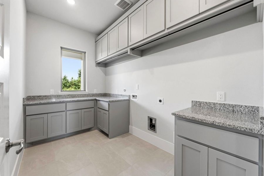 Laundry room with plenty of storage space. Laundry room with plenty of storage space.