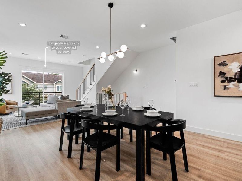 Entertain with ease as the kitchen, dining, and living room flow together under soaring 10-ft ceilings.