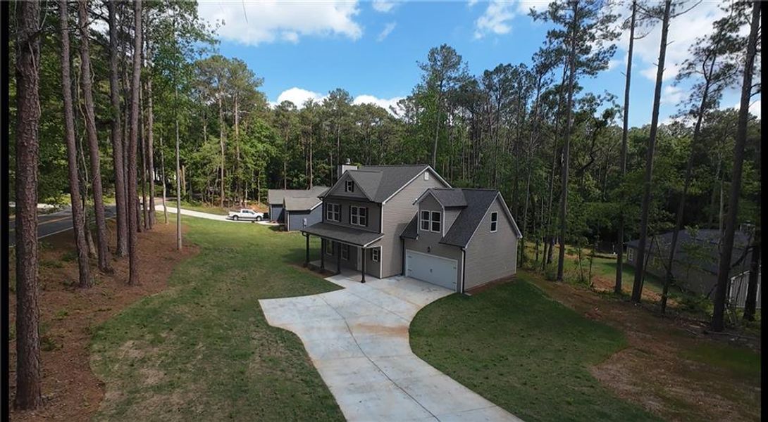Front exterior of a new home in , Monticello, GA, highlighting curb appeal (Image 15).