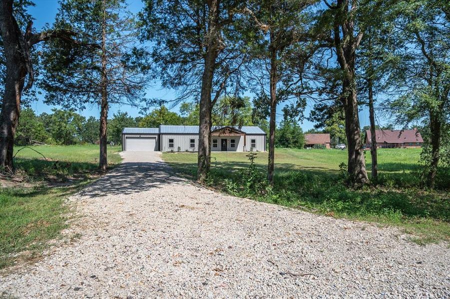 Front exterior of a new home in , Canton, TX, highlighting curb appeal (Image 26). Front exterior of a new home in , Canton, TX, highlighting curb appeal (Image 26).