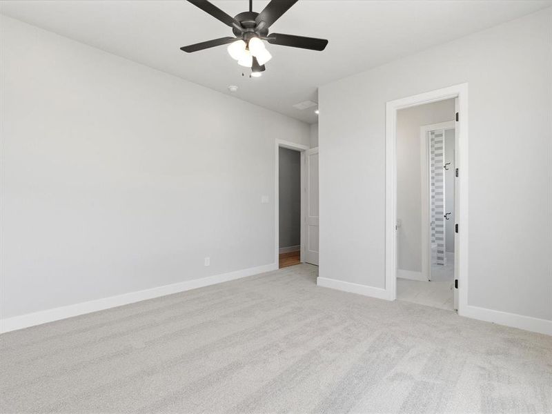 Neutral-toned carpeting paired with light gray wall paint
