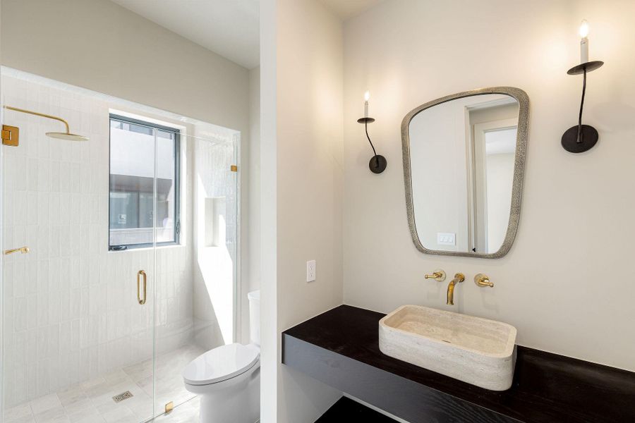 Full bathroom featuring a stall shower and vanity
