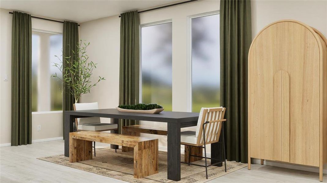 Dining space with light wood finished floors