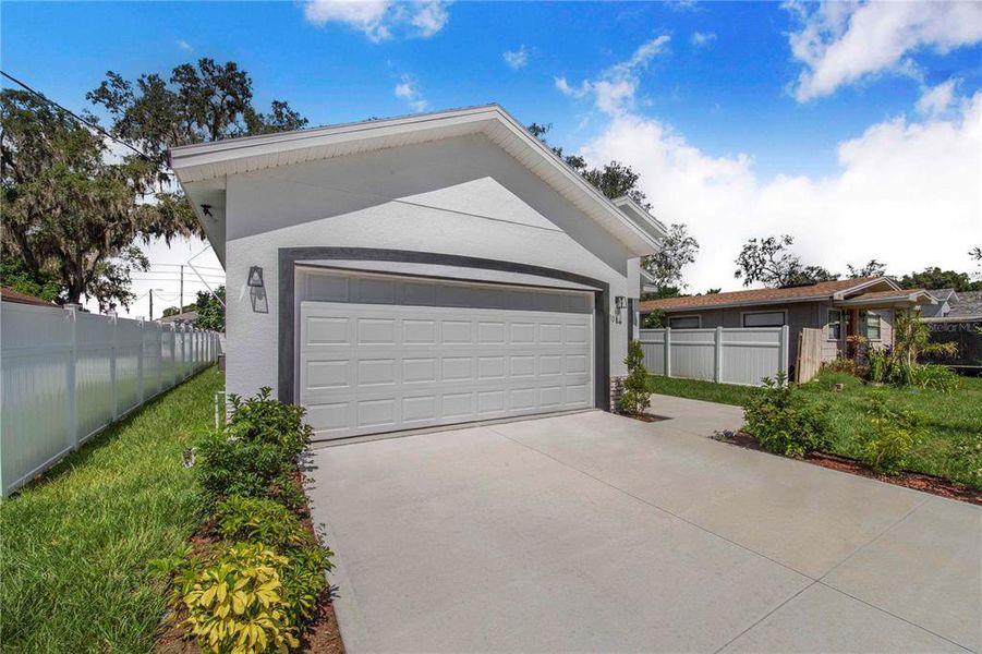Front exterior of a new home in , Haines City, FL, highlighting curb appeal (Image 2).