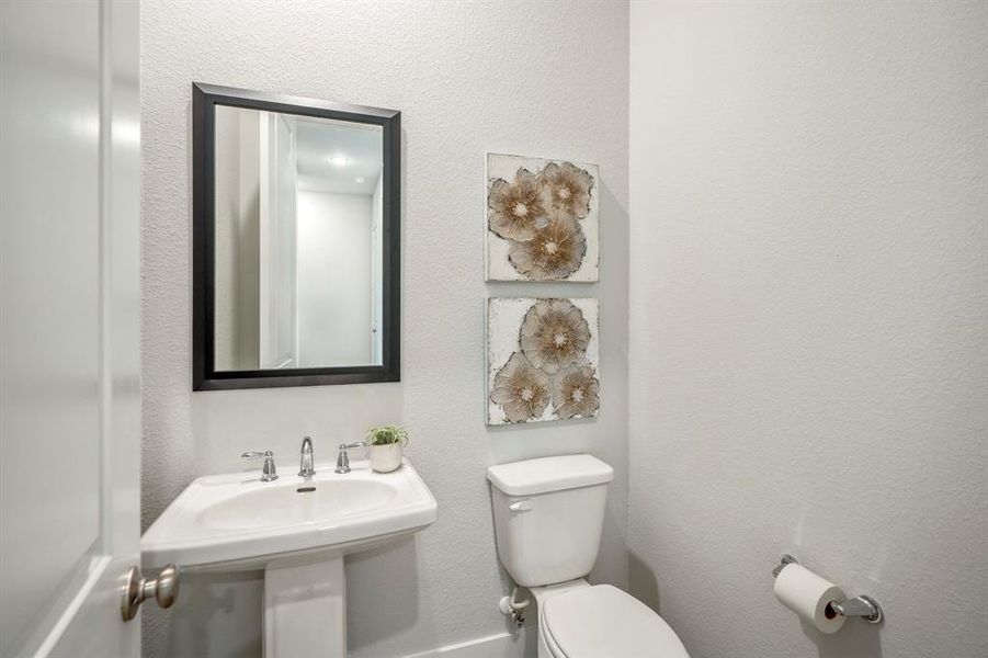 A stylish powder room with quality fixtures and a modern design make even the smallest spaces feel luxurious.