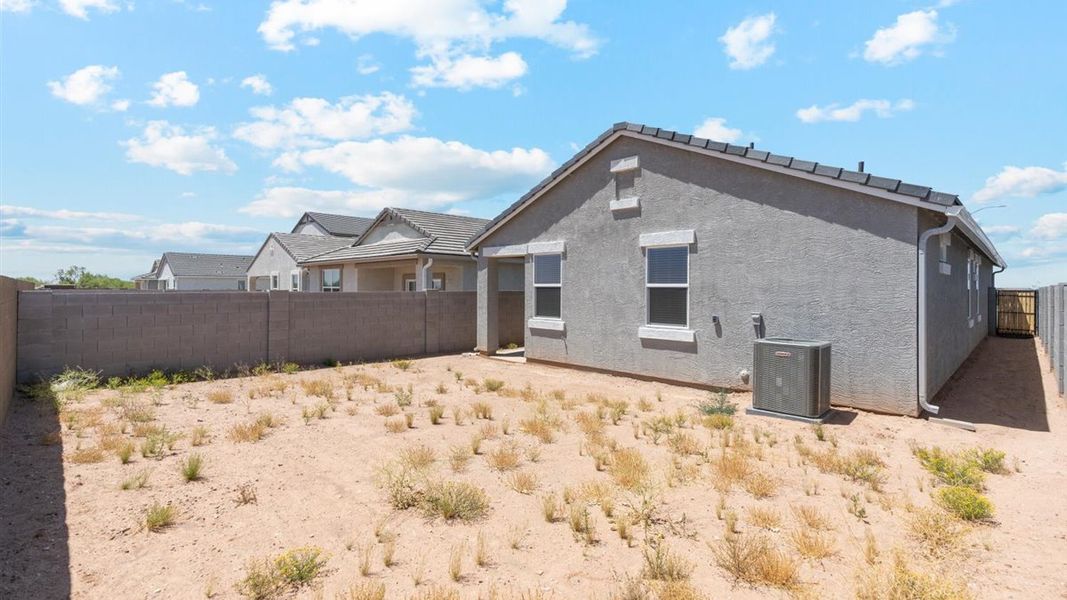 Exterior details and patio area of a home in Radiance at Superstition Vistas, Apache Junction (Image 21).