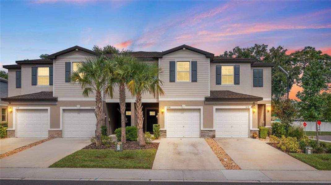 Front exterior of a new home in , Land O' Lakes, FL, highlighting curb appeal (Image 28). Front exterior of a new home in , Land O' Lakes, FL, highlighting curb appeal (Image 28).