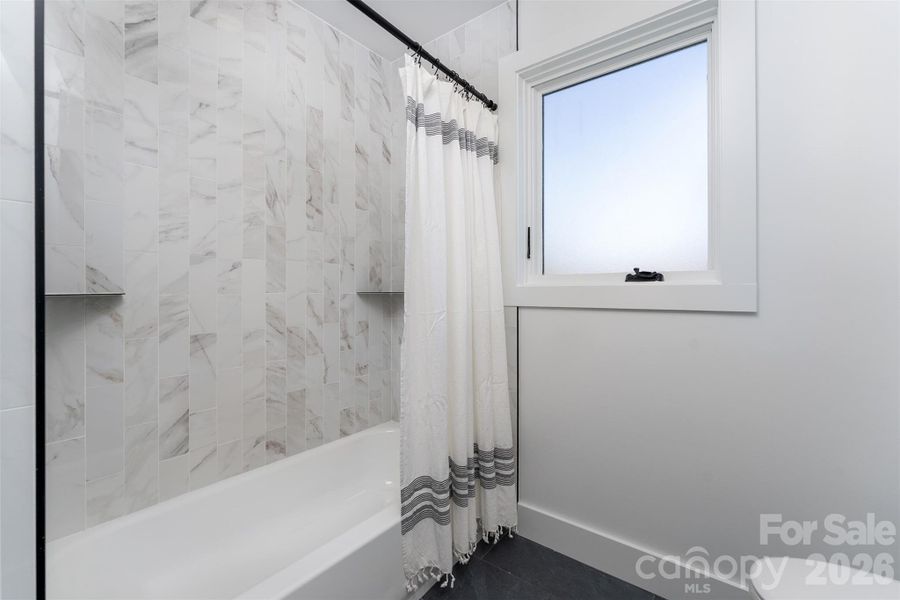 Hall bath complete with separate tub and toilet room