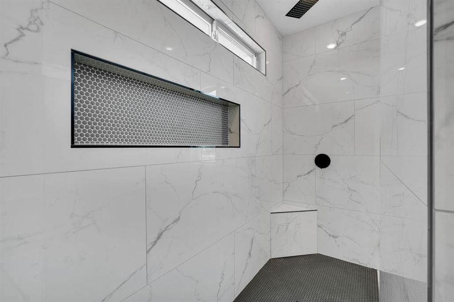 Bathroom featuring a tile shower