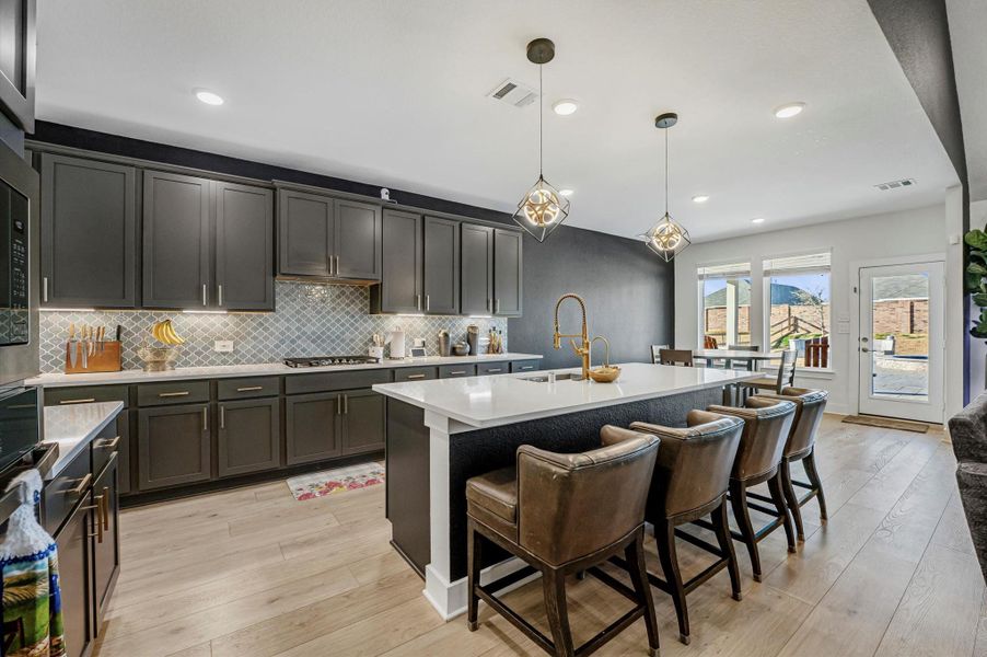 Upgraded gold hardware and fixtures and breakfast bar