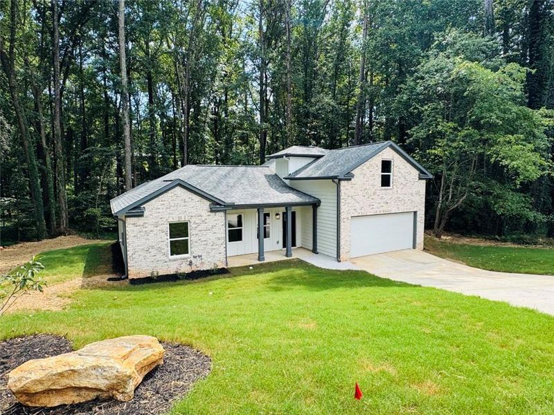 Front exterior of a new home in , Snellville, GA, highlighting curb appeal (Image 20).