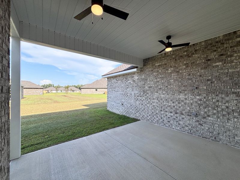 Exterior details and patio area of a home in Bird Song at Hammock Bay, Freeport (Image 4).