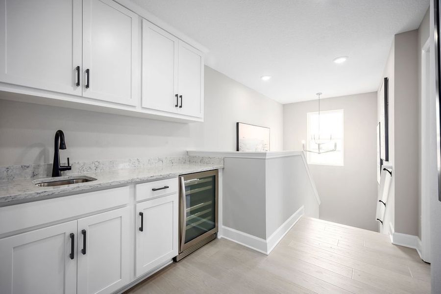 Representative furnished interior of a home built from the Maple by Risewell Homes in Cypress Bluff, Groveland (Image 8).
