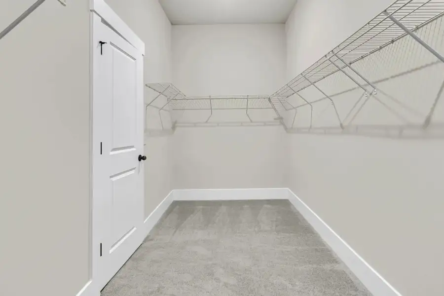 Primary Walk-In Closet Primary Walk-In Closet