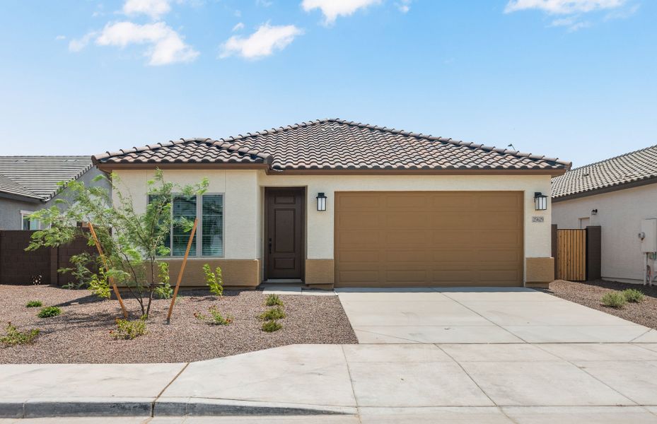 Front exterior of a new home in Hayden Estates, Buckeye, AZ, highlighting curb appeal (Image 2). Front exterior of a new home in Hayden Estates, Buckeye, AZ, highlighting curb appeal (Image 2).