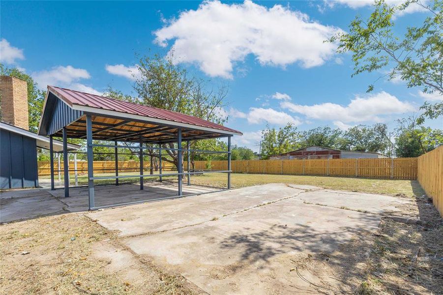 View of patio with an exterior structure and an outbuilding View of patio with an exterior structure and an outbuilding