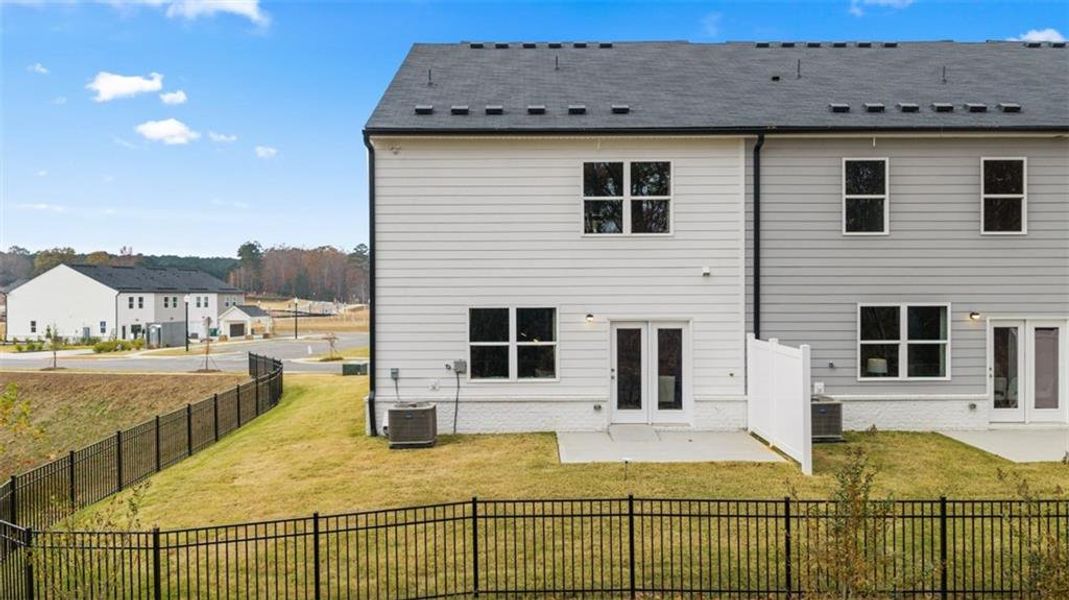 Exterior details and patio area of a home in Echo Glen, Stockbridge (Image 29).