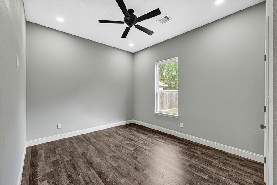 Third bedroom with ceiling fan and lots of natural light. Third bedroom with ceiling fan and lots of natural light.