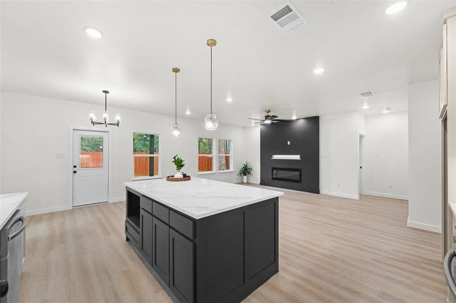 Spacious interior featuring wood-finish flooring and recessed lighting Spacious interior featuring wood-finish flooring and recessed lighting