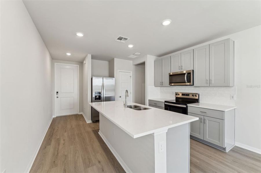 Furnished interior view inside a new home in Crescent Lakes - Premier Series, Punta Gorda (Image 10).