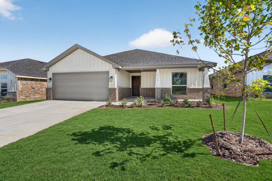 Front exterior of a new home in Craftsman's Corner, Cleburne, TX, highlighting curb appeal (Image 23).