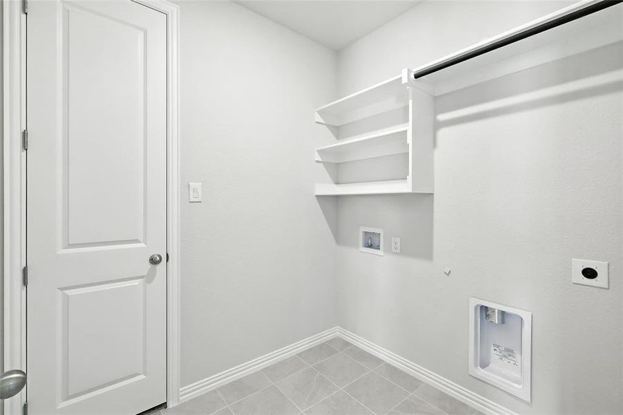 Laundry room featuring gas dryer hookup, electric dryer hookup, and washer hookup