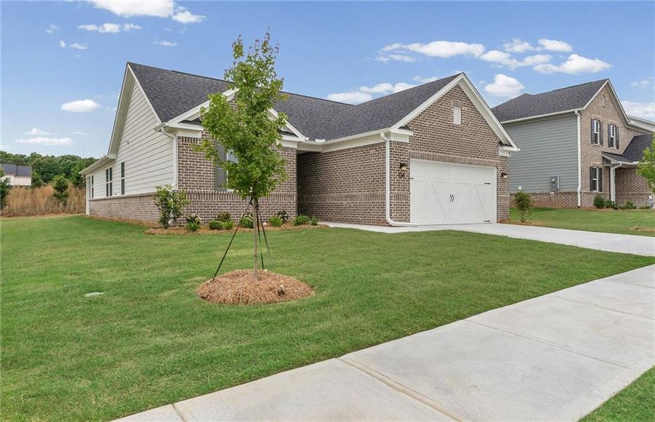 Front exterior of a new home in Overland, Locust Grove, GA, highlighting curb appeal (Image 2). Front exterior of a new home in Overland, Locust Grove, GA, highlighting curb appeal (Image 2).