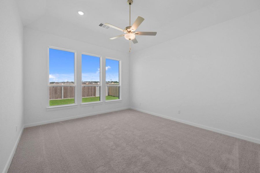 Primary Bedroom with elevated ceiling Primary Bedroom with elevated ceiling