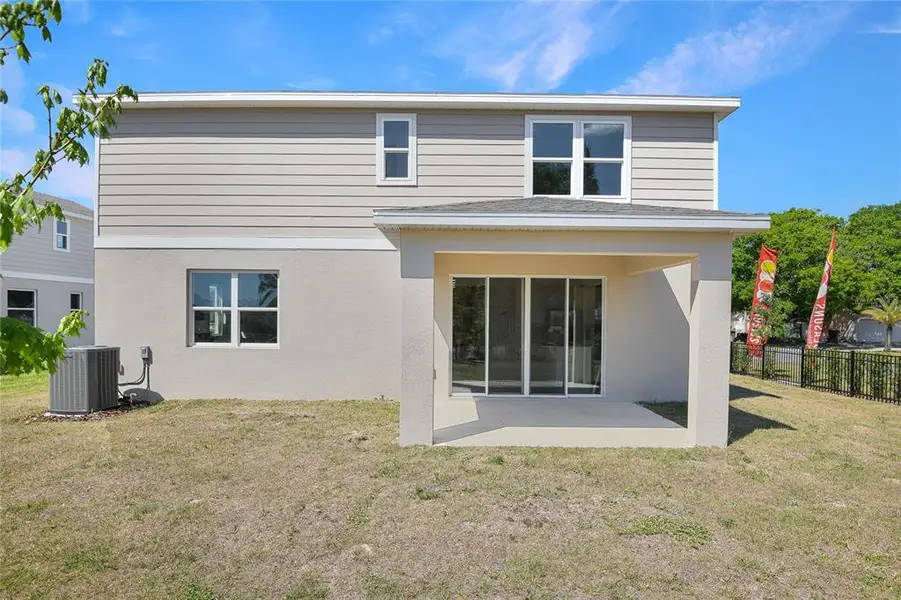 Exterior details and patio area of a home in Seaport Village, Tavares (Image 3).