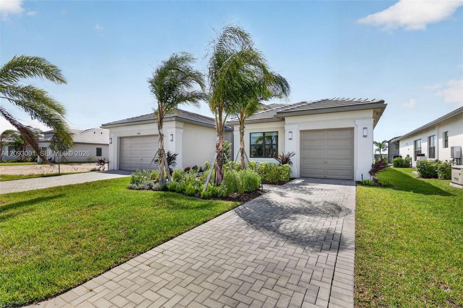Front exterior of a new home in , Port St. Lucie, FL, highlighting curb appeal (Image 24). Front exterior of a new home in , Port St. Lucie, FL, highlighting curb appeal (Image 24).
