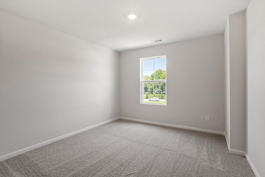 Spacious, unfurnished interior of a new home in Cambridge Reserve, Angier (Image 30).