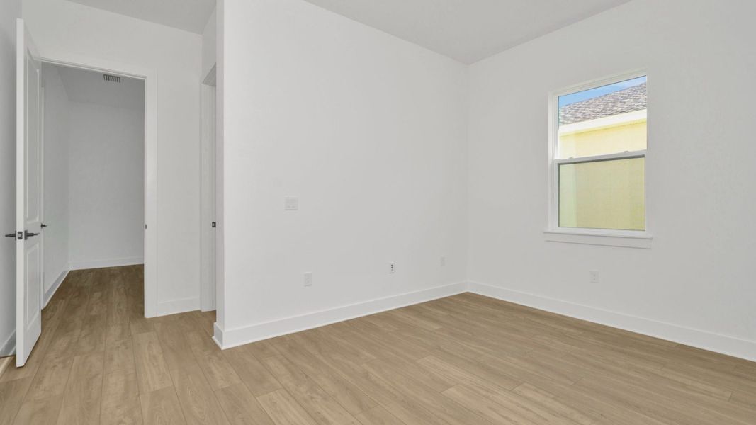 The Third Bedroom of a DRB Homes Grand Hawk which is offered as a home plan at Serengeti in Spring Hill, FL.