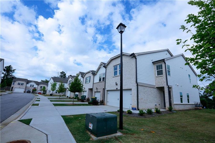 Front exterior of a new home in , Lawrenceville, GA, highlighting curb appeal (Image 25).