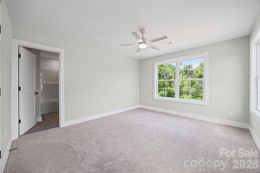 Upstairs guest room with attached bathroom.