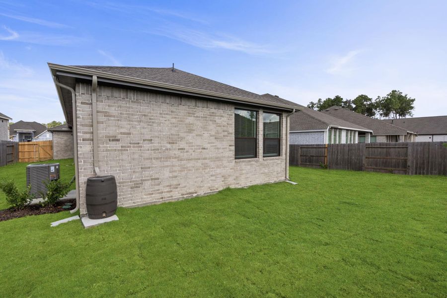 Exterior details and patio area of a home in Artavia, Conroe (Image 16).
