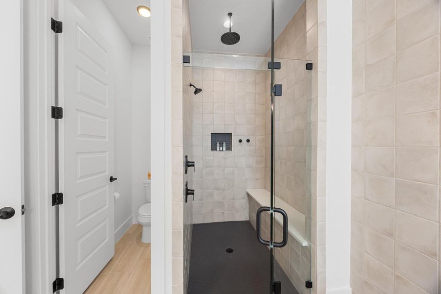 Full bath featuring a shower stall