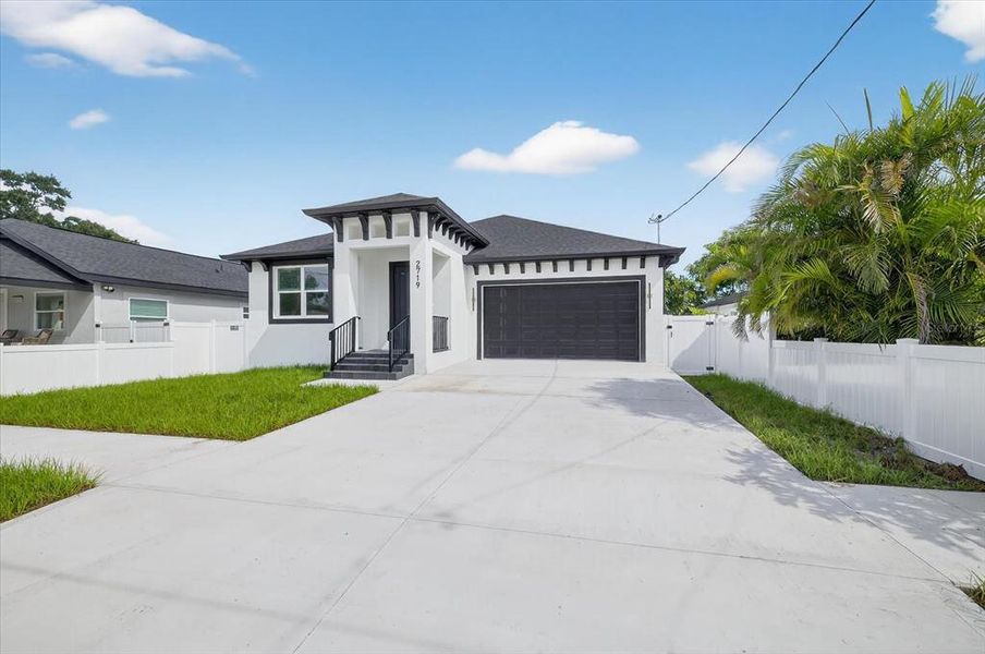 Front exterior of a new home in , Tampa, FL, highlighting curb appeal (Image 26).