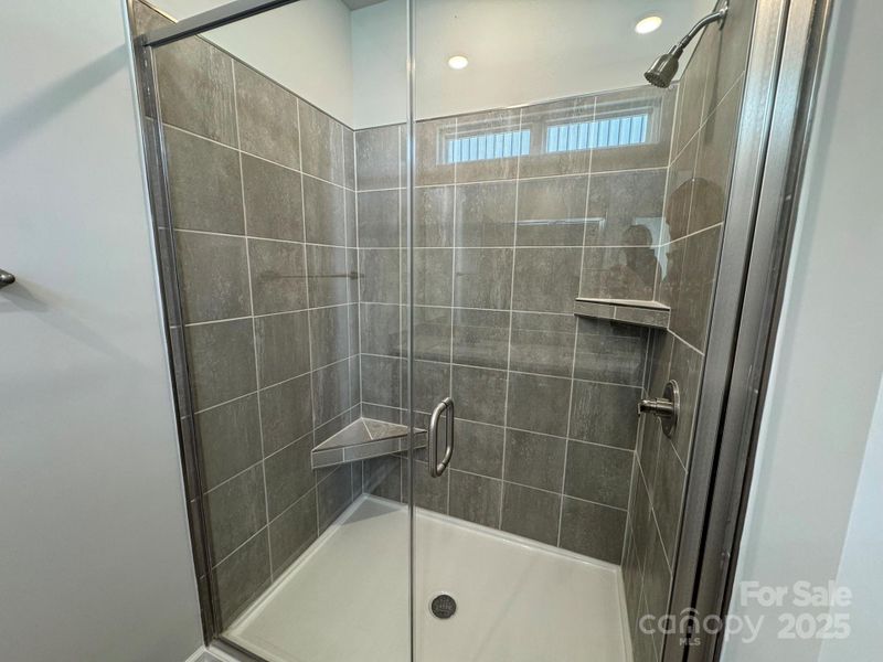 Primary Bath Walk-in Shower with Tiled Wall and ledge Primary Bath Walk-in Shower with Tiled Wall and ledge