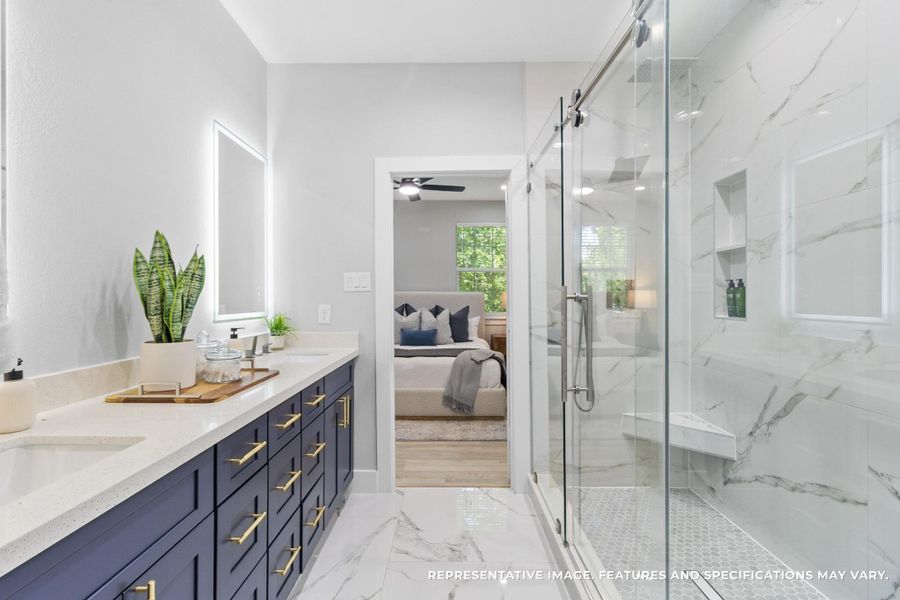 The spa-inspired bathroom is all yours, with dual sinks, sleek finishes, and plenty of space to get ready side by side.