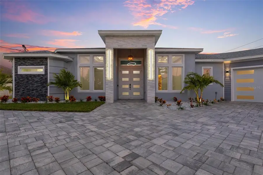 Front exterior of a new home in , Palm Coast, FL, highlighting curb appeal (Image 1). Front exterior of a new home in , Palm Coast, FL, highlighting curb appeal (Image 1).
