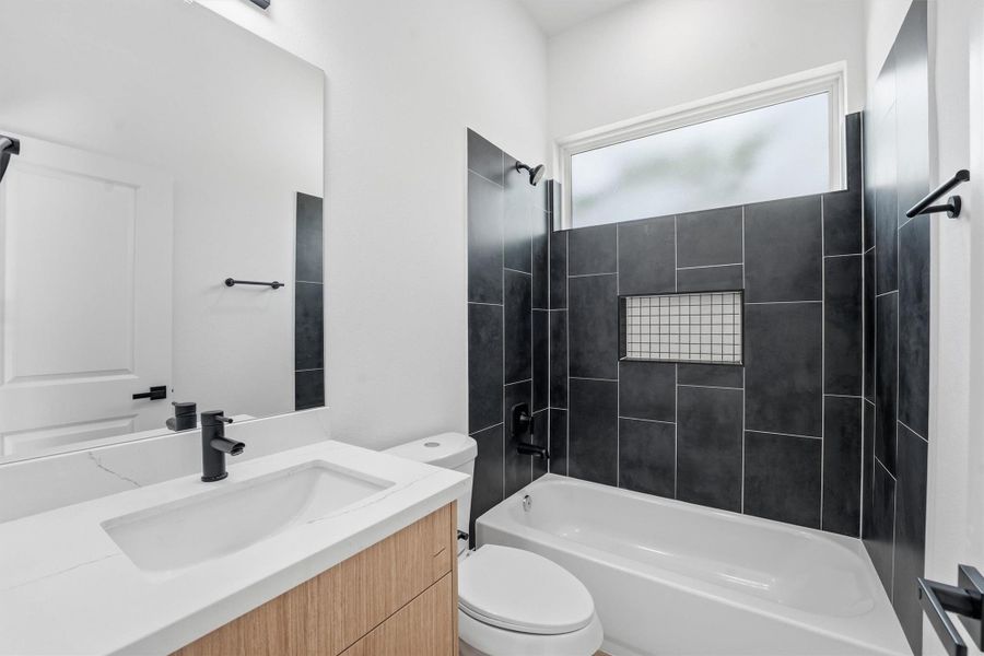 Secondary bath with elegant finishes.