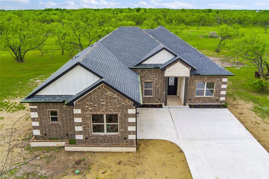 Front exterior of a new home in , Corsicana, TX, highlighting curb appeal (Image 20).
