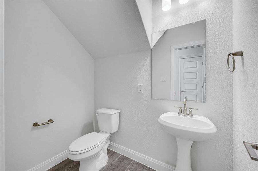 Powder bathroom for guests off the hallway