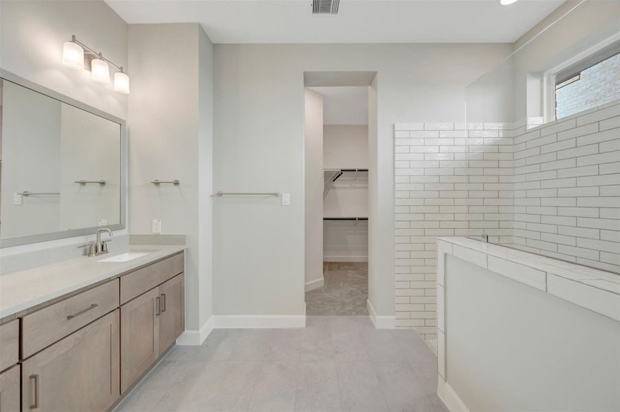 Furnished interior view inside a new home in COLTON - Reserve Collection, Todd Mission (Image 17).