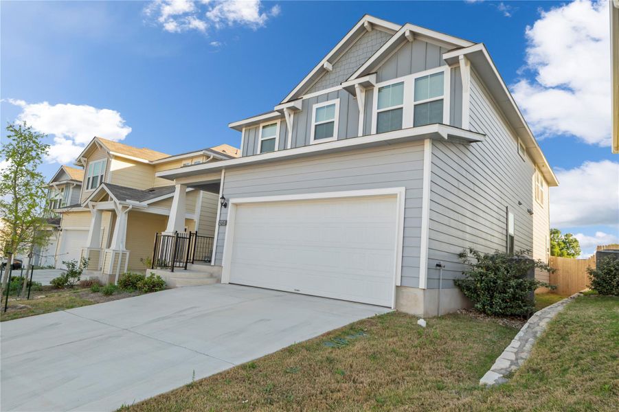 Front exterior of a new home in Edgebrooke, Pflugerville, TX, highlighting curb appeal (Image 2). Front exterior of a new home in Edgebrooke, Pflugerville, TX, highlighting curb appeal (Image 2).