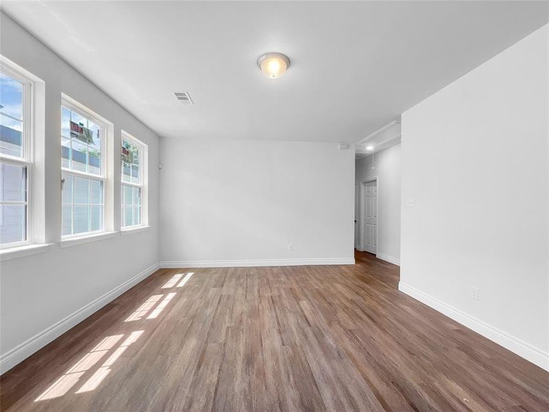 Spare room featuring wood-type flooring