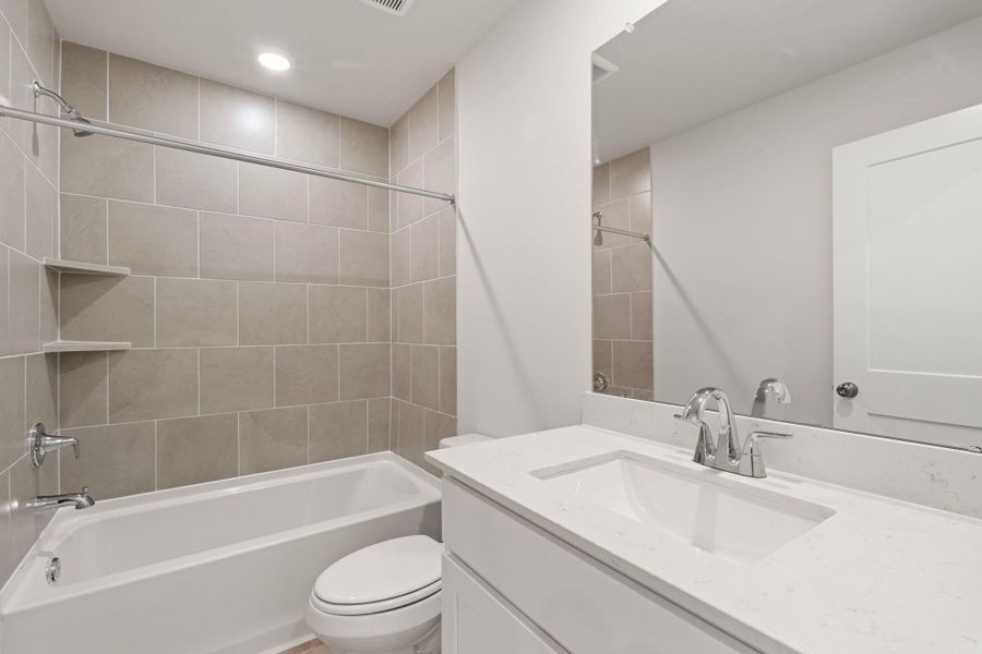 Furnished interior view inside a new home in Sunterra, Katy (Image 8).