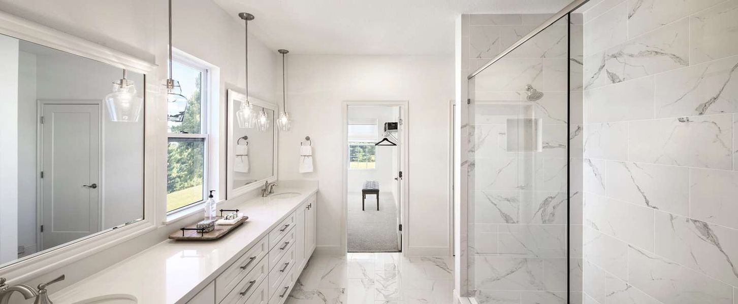 Furnished interior in a model home at Oakfield Trails Signature in Parrish (Image 22).