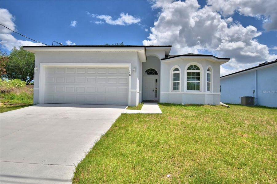 Front exterior of a new home in , Winter Haven, FL, highlighting curb appeal (Image 20).